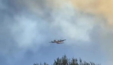 Aerial Tanker Flies Through Smoke During San Diego Fire