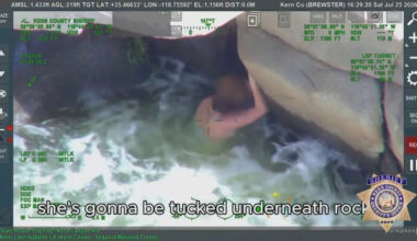 Woman found clinging to underside of rock in dramatic California river rescue