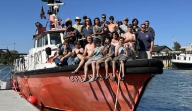Alameda Post - A group of young people smile together on the front of a boat. They are the Sea Scouts on a large summer trip.