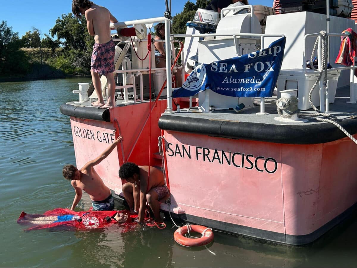 Alameda Post - Sea Scouts practice rescuing a dummy off of the back of the Sea Fox boat.