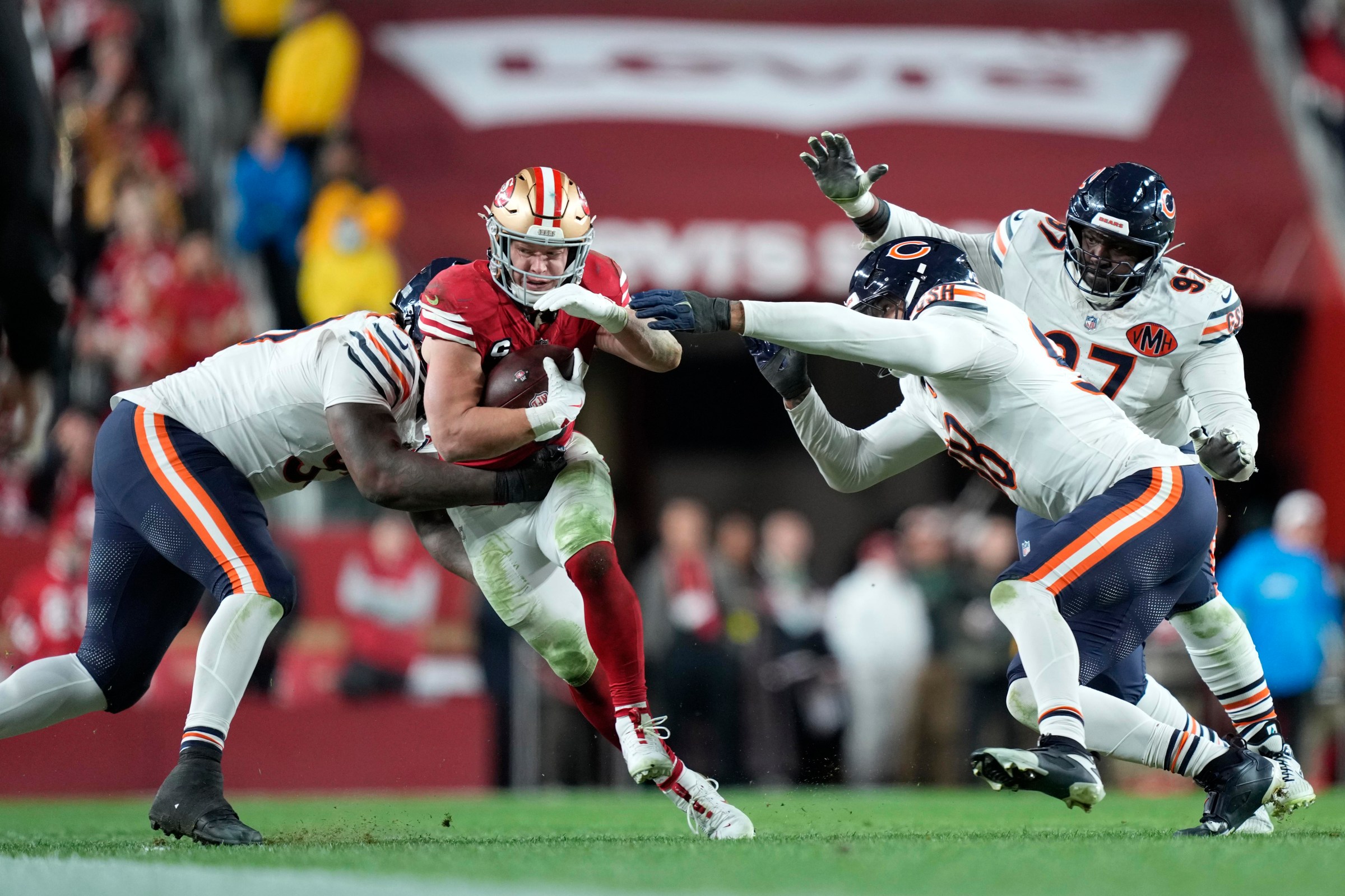 Dec 28, 2025; Santa Clara, California, USA; Chicago Bears defensive tackle Gervon Dexter Sr. (99) and defensive end Montez Sweat (98) tackle San Francisco 49ers running back Christian McCaffrey (23) in the second half at Levi’s Stadium. Mandatory Credit: Kyle Terada-Imagn Images