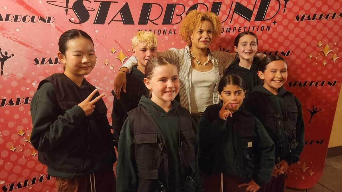 Elinor Steffy, center, poses with dancers she coached through the Hawkins School of the Performing Arts. Steffy, a beloved capital region dance instructor, was remembered by her family and students for her mentorship and commitment to youth dance following her death on Friday, Jan. 23, 2026.