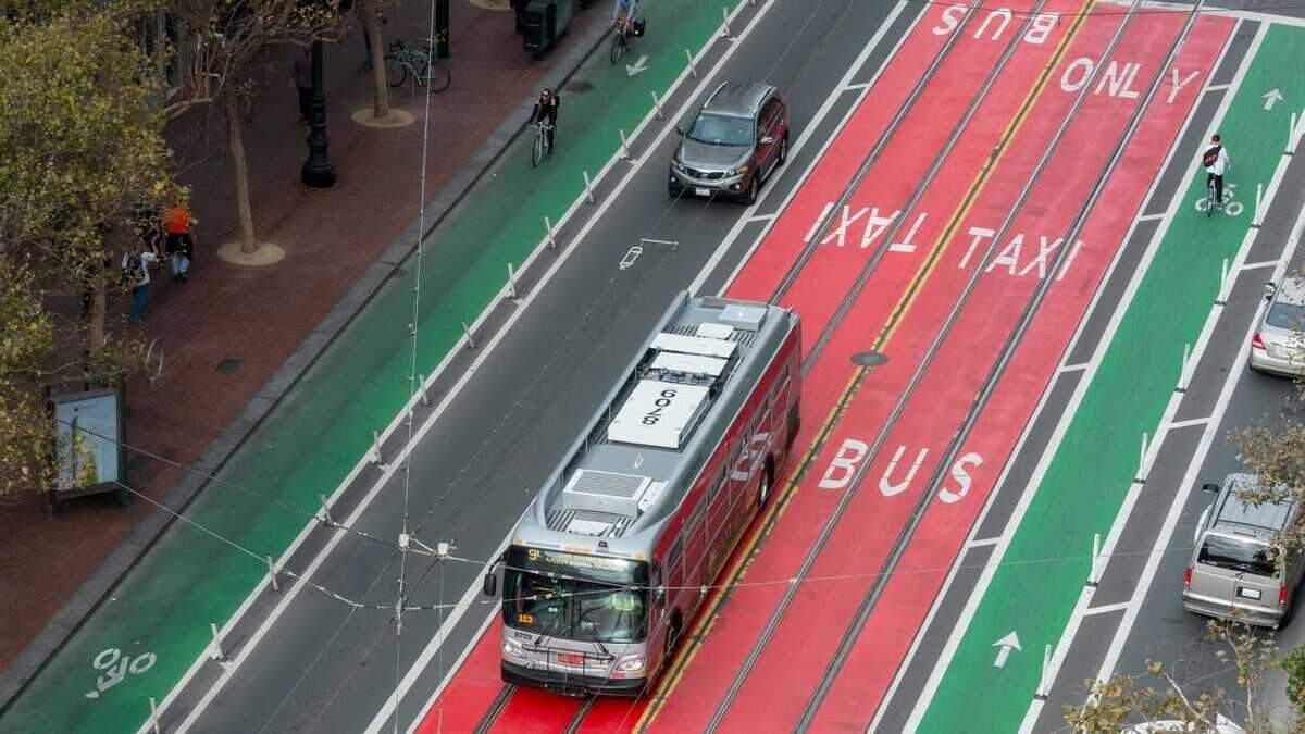 A bus travels in the center-running Van Ness Bus Rapid Transit corridor in San Francisco. The system uses dedicated bus lanes, transit-priority signals and enhanced stations — features Sacramento Regional Transit will evaluate as it studies a bus rapid transit connection to Sacramento International Airport.