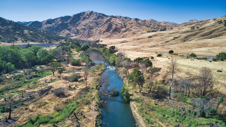 Fields and mountains extend either side of Putah Creek in California