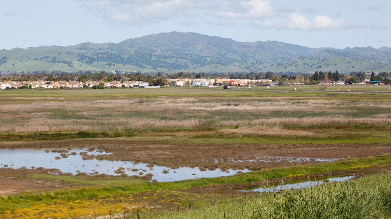 Vast countryside with distant houses and mountains in Solano County, California.
