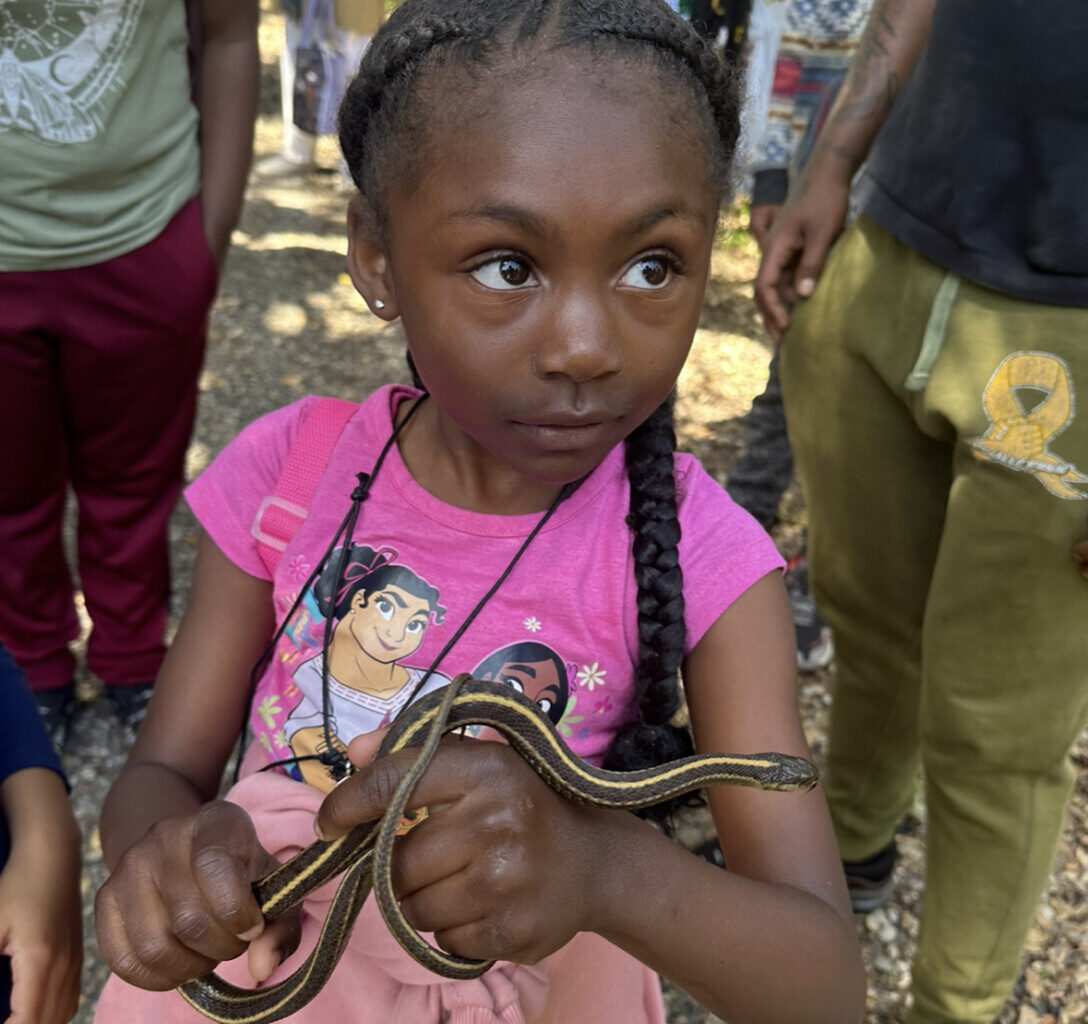 little-black-girl-with-braids-holds-snake-, Trap Nature: Oakland edition, Culture Currents Featured