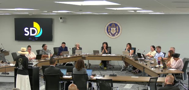 La Jolla Historical Society historian Carol Olten (at podium) addresses the San Diego Historical Resources Board during its July 23 meeting. (Screenshot by Ashley Mackin-Solomon)