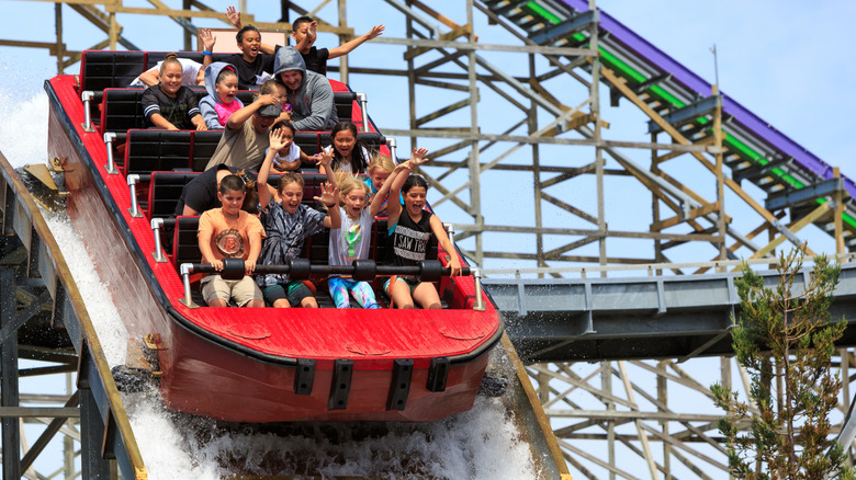 People going down a splashy water ride at Six Flags Discovery Kingdom in Vallejo.