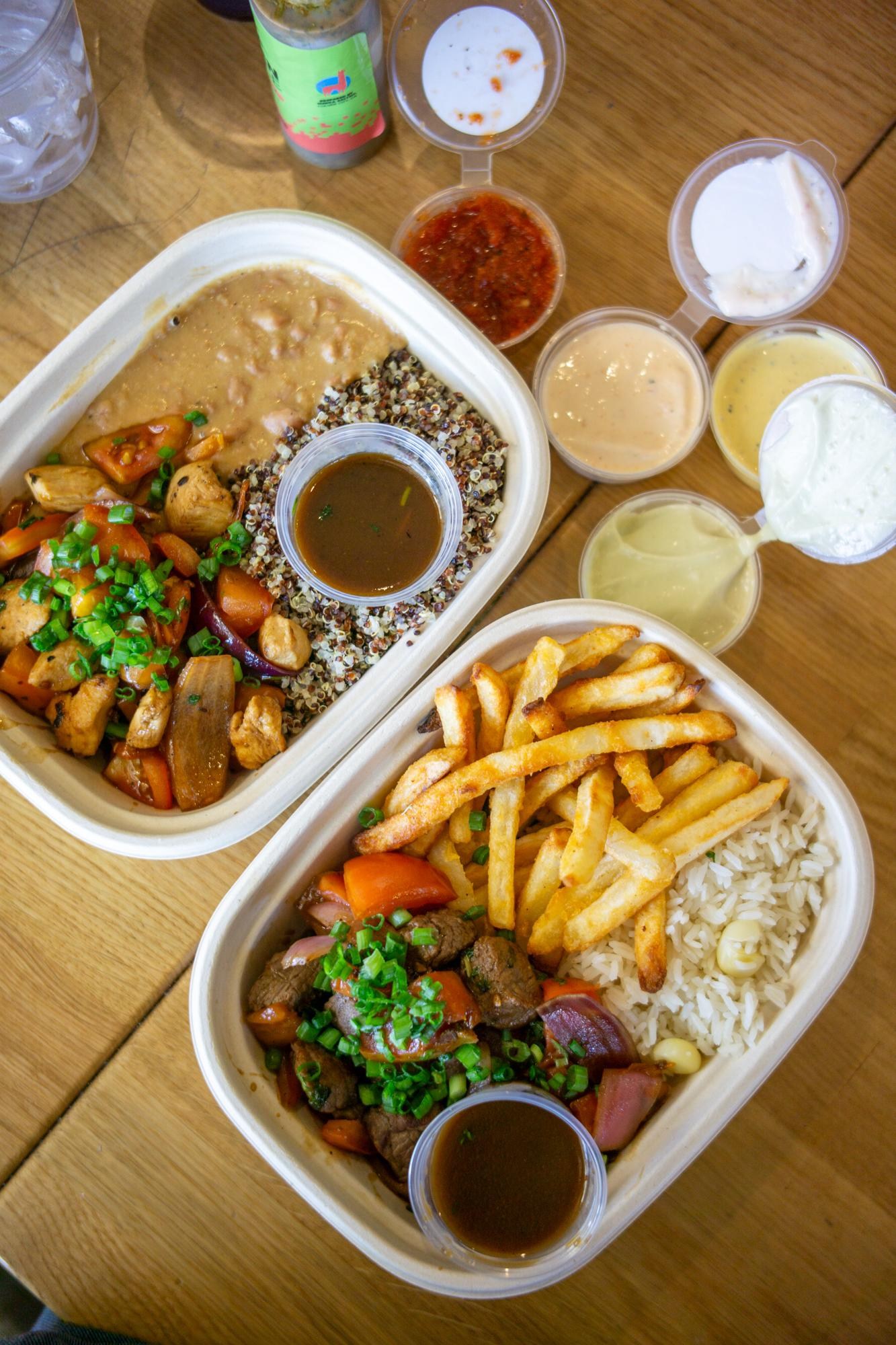 Overhead shot of saltado bowls at Merka Saltao.