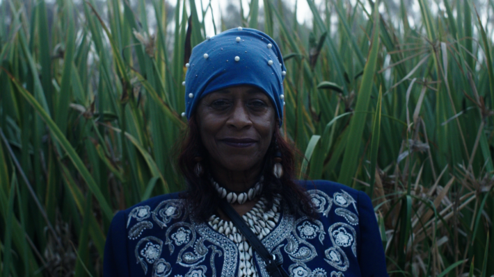 a woman among tall grass