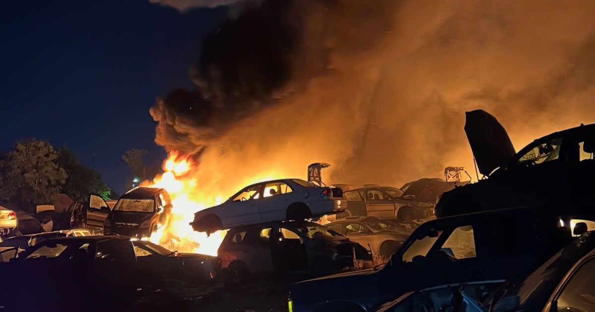 Fire at Modesto auto wrecking yard destroys around 100 vehicles