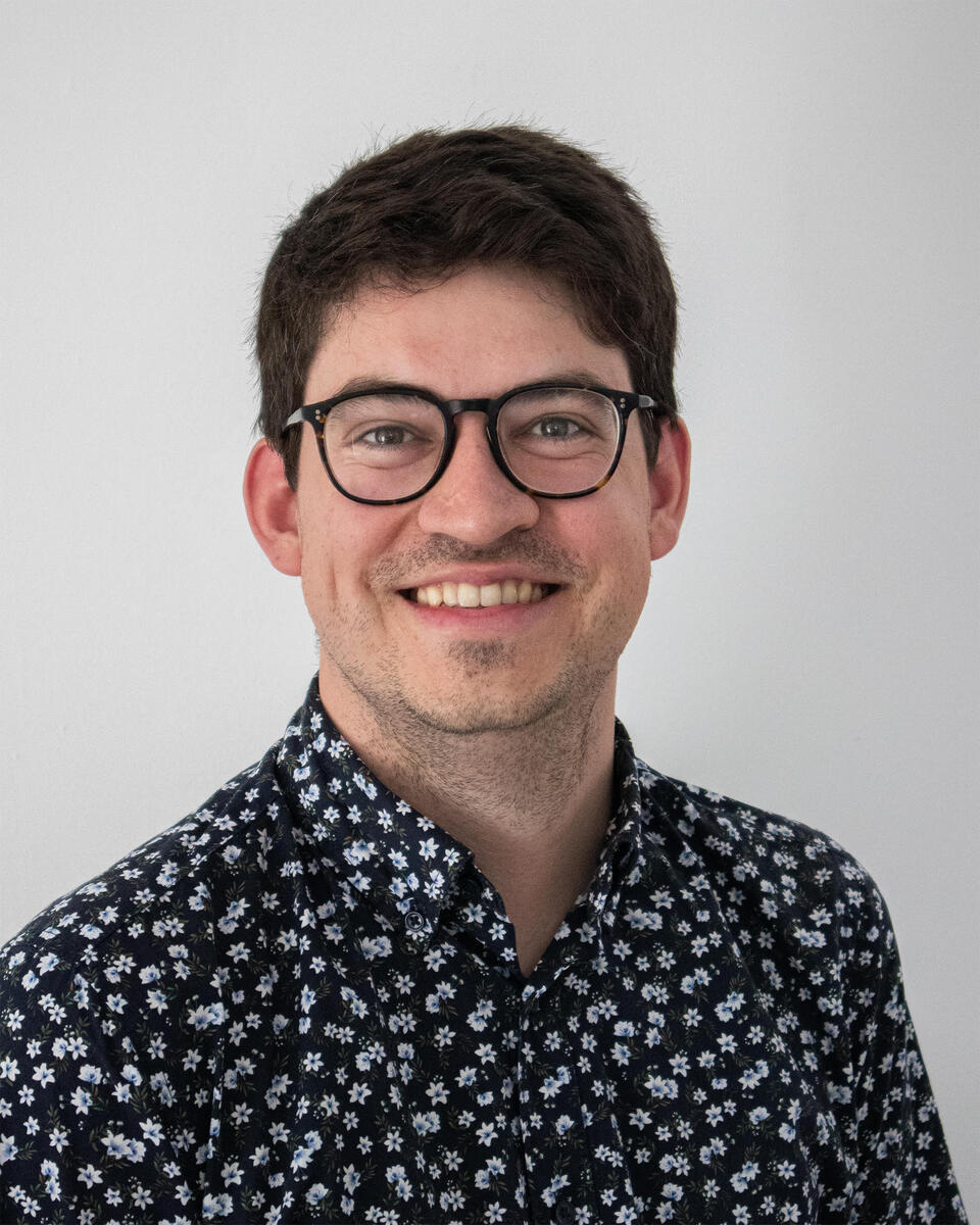 headshot of man smiling
