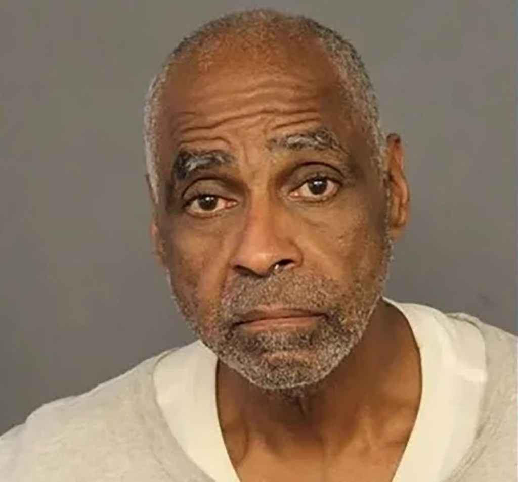 Mugshot of Ricky Dawson, a 65-year-old Black man with a graying beard and short hair.