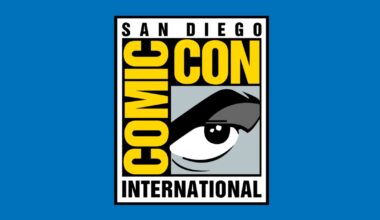 San Diego Comic Con logo on a blue background. The logo has a grayscale animated eye and large yellow block text.