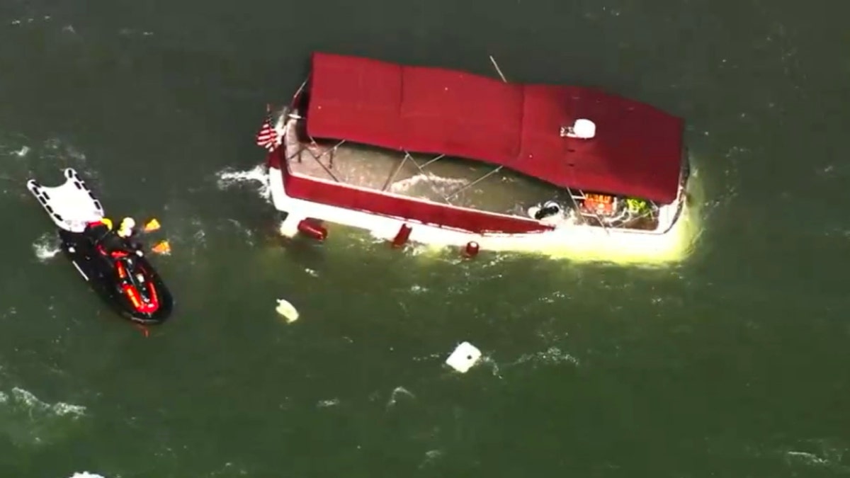 Rescuers pulled people from the water after a recreational boat capsized near Alcatraz Island in San Francisco Bay on Tuesday, leaving one person dead and two missing.