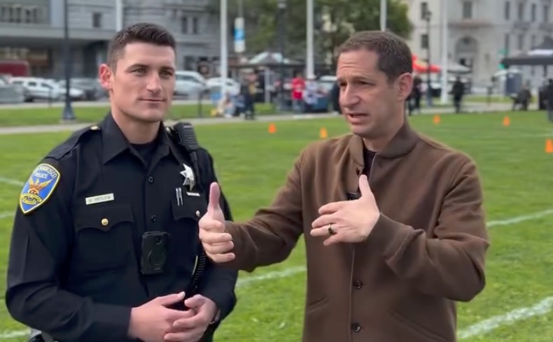 San Francisco Police Officer Mike Petuya with Mayor Daniel Lurie.