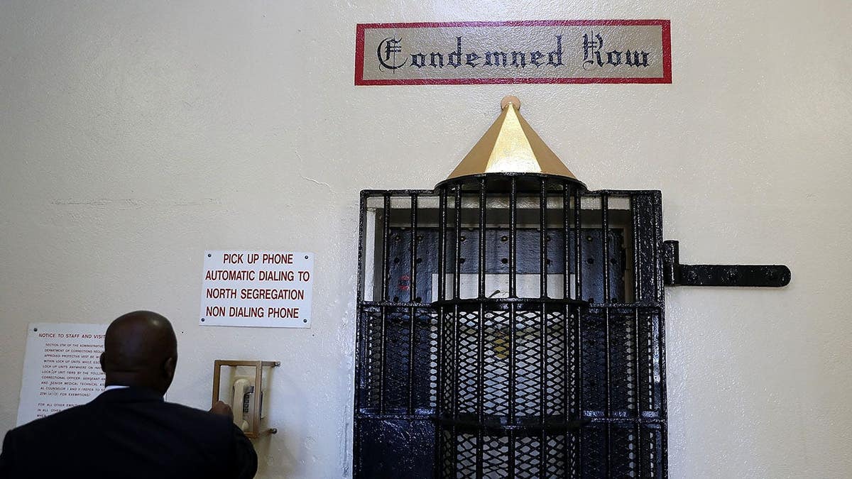 Lt. Sam Robinson calls to open a door at San Quentin State Prison death row