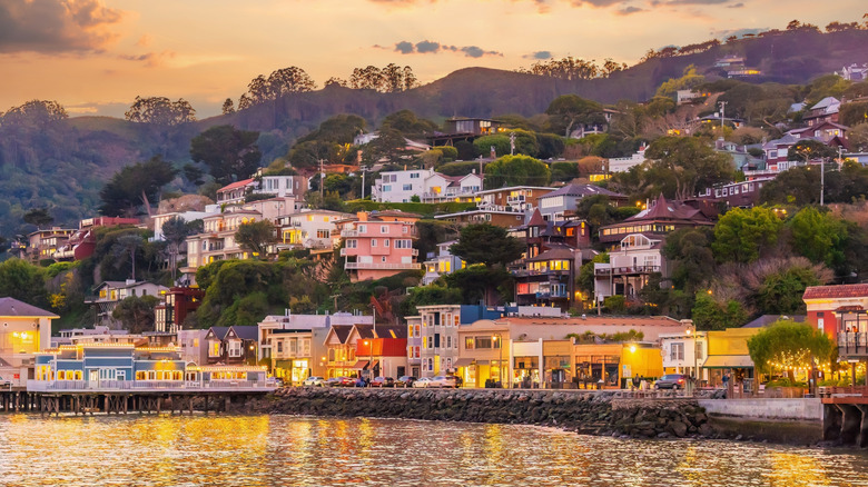 A view of Sausalito's Bridgeway Boardwalk from the Bay, with colorful houses climbing the hills