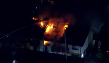 Shots fired, Woodland Hills townhouse catches fire during LAPD standoff with domestic violence suspect