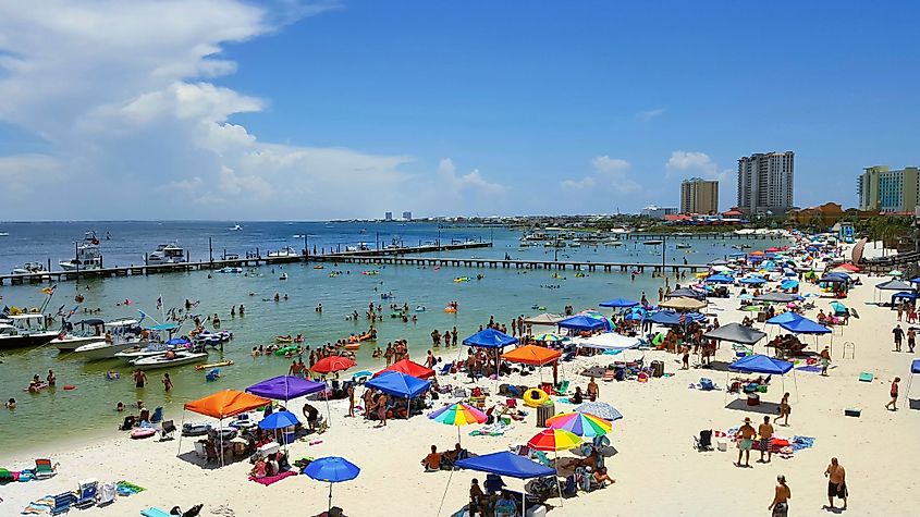 The white quartz sand and emerald-green water of Pensacola Beach, Florida.