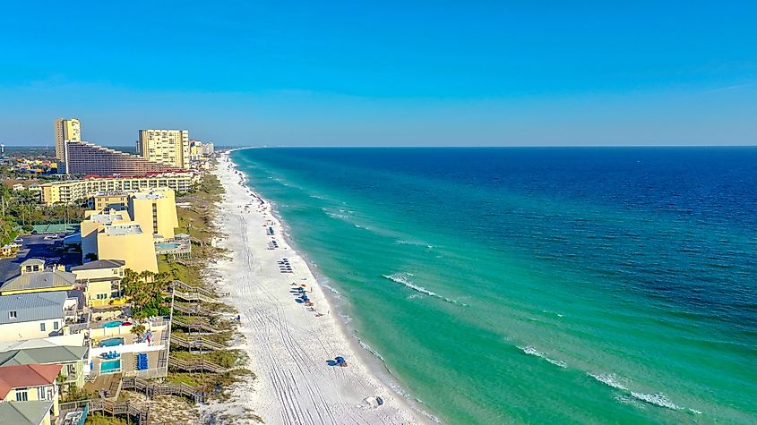 The Gulf shoreline and emerald water at Miramar Beach, Florida.
