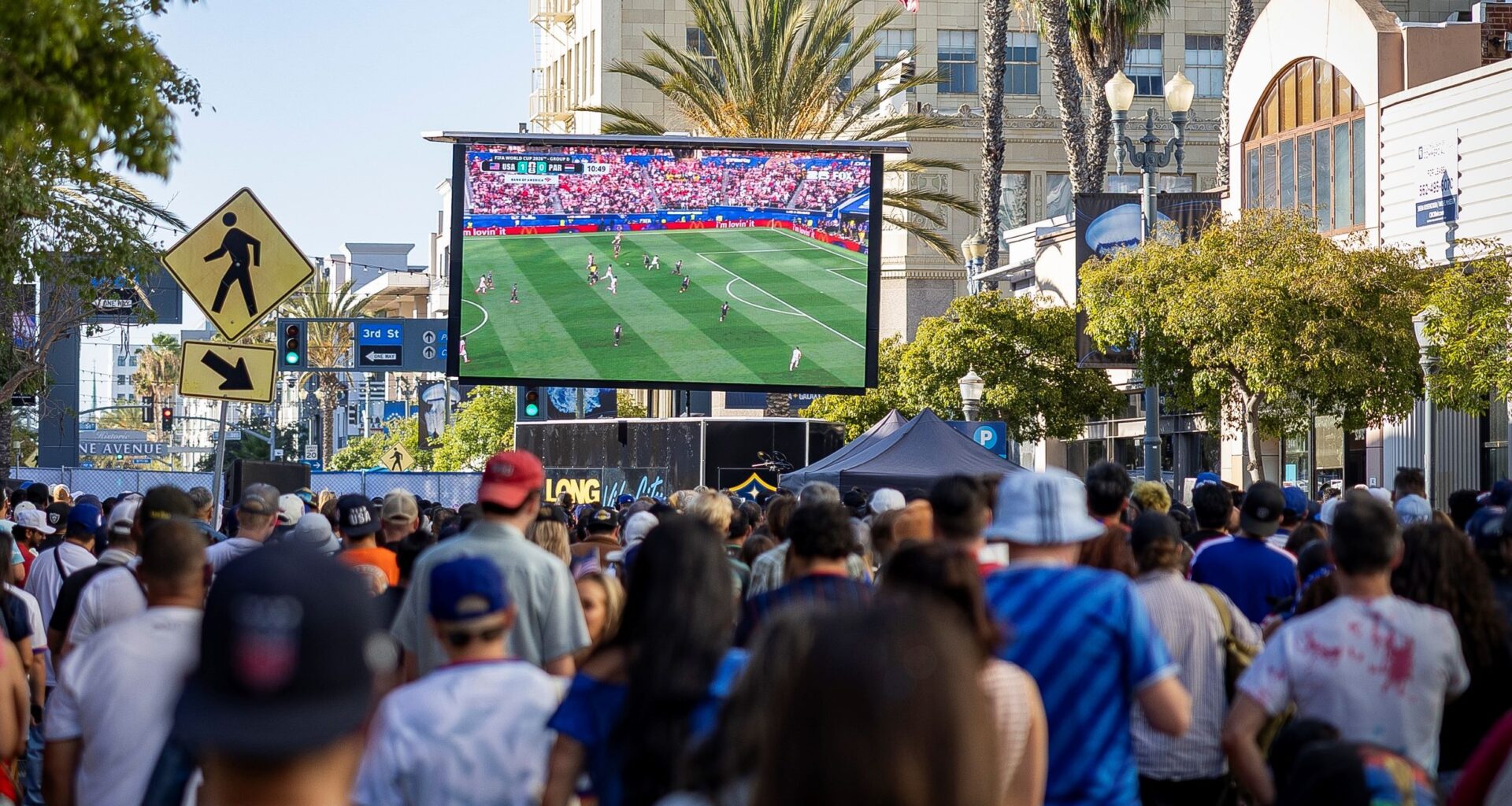 Crowds gather in downtown Long Beach to watch a global soccer match between the United States and Paraguay on June 12, 2026.