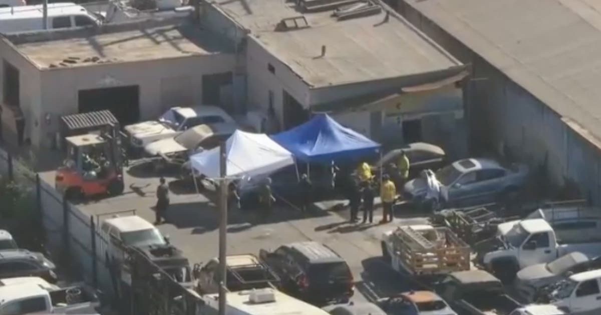 3 charged with premeditated murder after body found in burned car at South LA tow yard