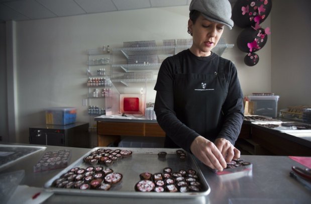 Fashion designer turned chocolatier Michelle Lomelin, seen here in her Sweet Petite Confections shop in Carlsbad in 2016, closed her retail business on June 30, 2026. (Howard Lipin / U-T File)