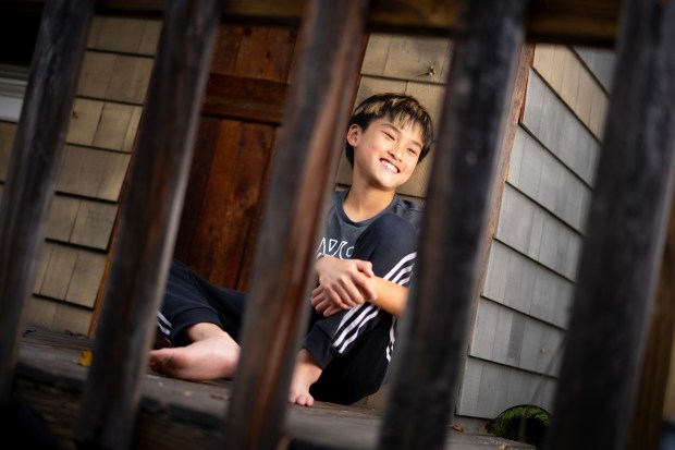 At his home in Mira Mesa 12-year old Joshua Tran sat in his backyard clubhouse reflecting back on his essay he wrote, "What the American Flag Means to Me." (Nelvin C. Cepeda / The San Diego Union-Tribune)