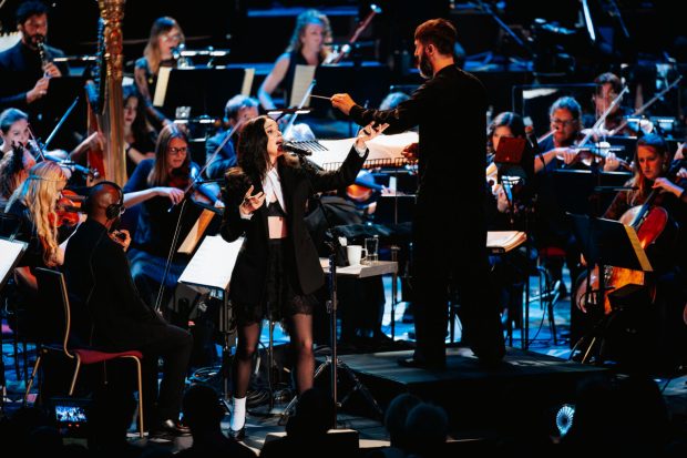 St. Vincent is shown at her 2025 London concert with the Jules Buckley Orchestra. The performance has now been released on her new double album, "Live in London!" (Andy Paraside / Courtesy Nasty Little Man)