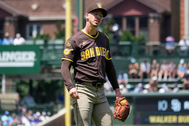 Padres starting pitcher Walker Buehler reacts after Seiya Suzuki hits the first of the Cubs' eight home runs on Wednesday. (AP Photo/Nam Y. Huh)
