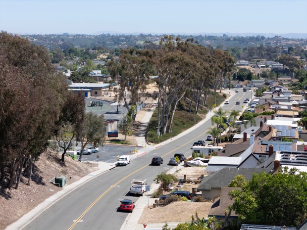 On Tuesday, July 21, 2026, drivers steer their cars down the hill on Dusk Drive, passing William Penn Elementary one of the schools singled out by San Diego Unified School District as in dire need of safety upgrades like speed bumps, new crosswalks, better signage and more.  (Nelvin C. Cepeda / The San Diego Union-Tribune)