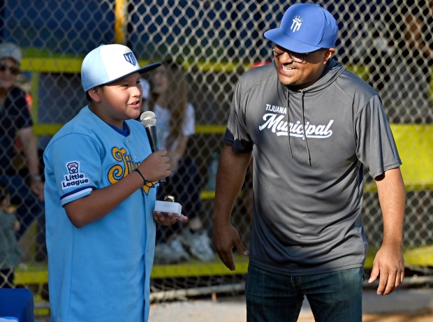 Nestor Melchor #08 (left), along with each member of the Tijuana Municipal Little League team were given a moment to speak of their favorite moments of games played and given championship rings by DarÃ­o Venegas, president of the Tijuana Municipal Children's and Youth Baseball League at the Otay baseball fields in Tijuana, Mexico on Monday, July 13, 2026. The little league team will represent Mexico for a third time during next month's Little League World Series. (Carlos Moreno / The San Diego Union-Tribune)