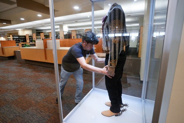 On Tuesday, June 23, 2026, Jose Amaral, a mariachi student at Southwestern College, helped with the packing of the Jorge Negrete costume from the Mariachi Museum on campus. The museum is in the process of packing up and, for now, going into storage until a new location can be found. (Nelvin C. Cepeda / The San Diego Union-Tribune)