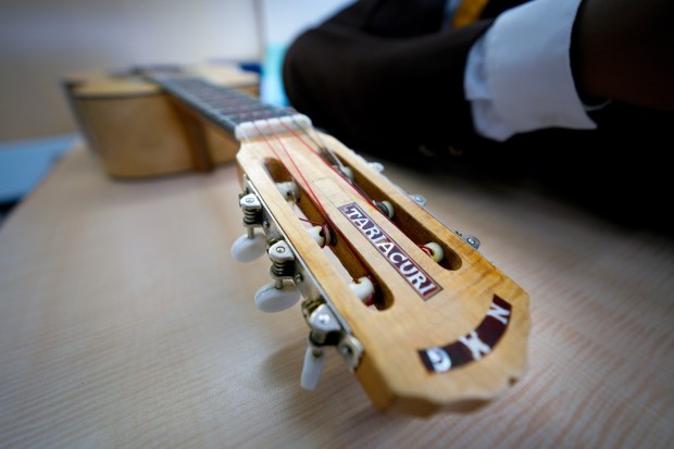 The guitar belonging to mariachi performer Juan Mendoza is prepped for packing. On Tuesday, June 23, 2026, volunteers helped with the packing of the various costumes from the Mariachi Museum on campus. Volunteers are in the process of packing up all the museum exhibits and, for now, going into storage until a new location can be found. (Nelvin C. Cepeda / The San Diego Union-Tribune)