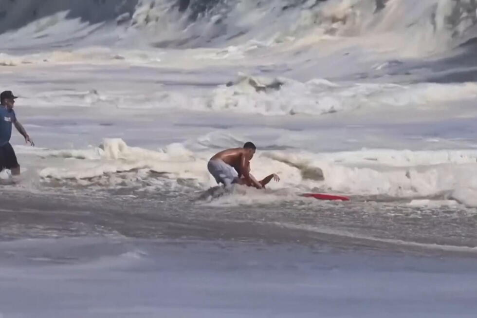 Father of boy rescued from pounding California surf says he is beyond grateful to teen lifeguard