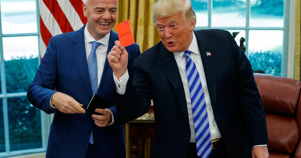 World Cup final protesters give red cards to Trump, FIFA president