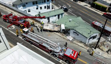 L.A. Fire rescue a man trapped in a truck that crashed into a building
