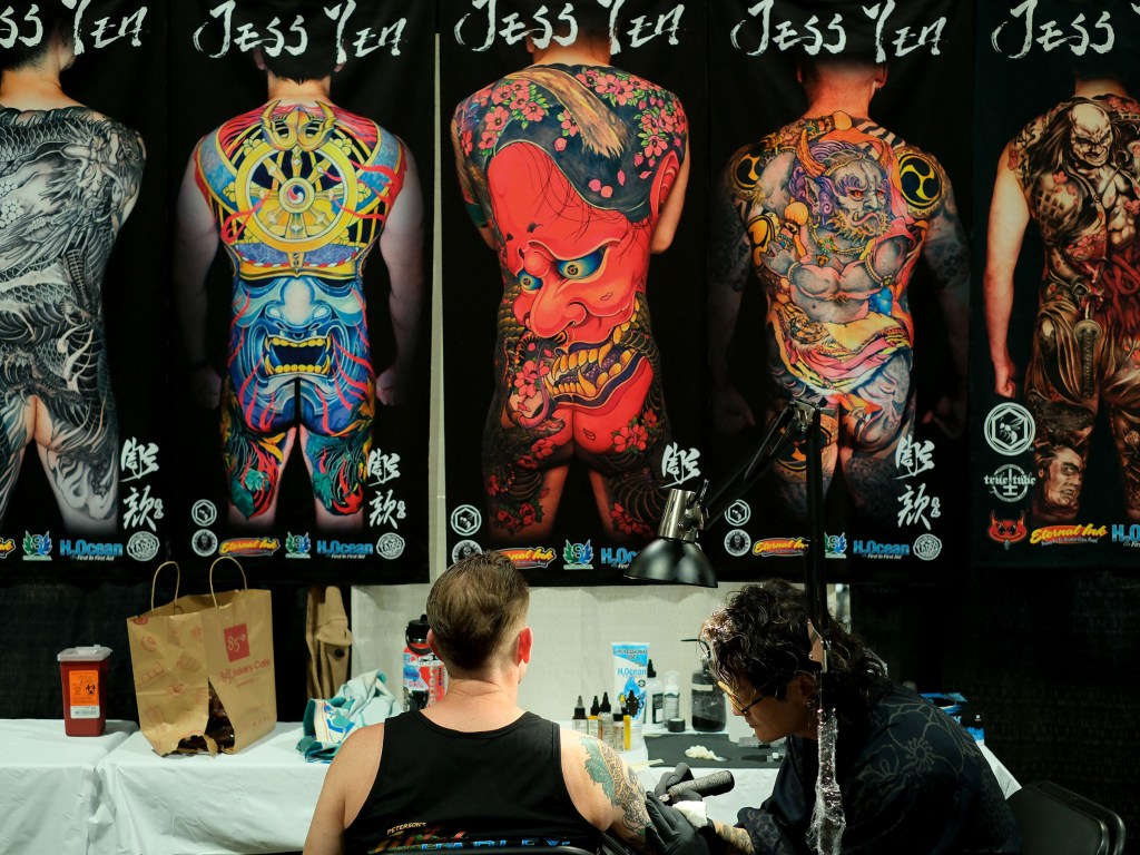 Tattoo artist at Long Beach Tattoo Arts Festival 2026 at the Long Beach Entertainment Center.