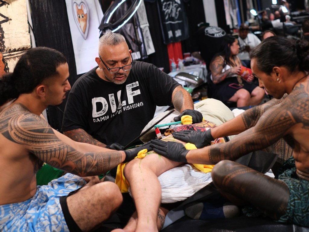 Tattoo artist at Long Beach Tattoo Arts Festival 2026 at the Long Beach Entertainment Center.