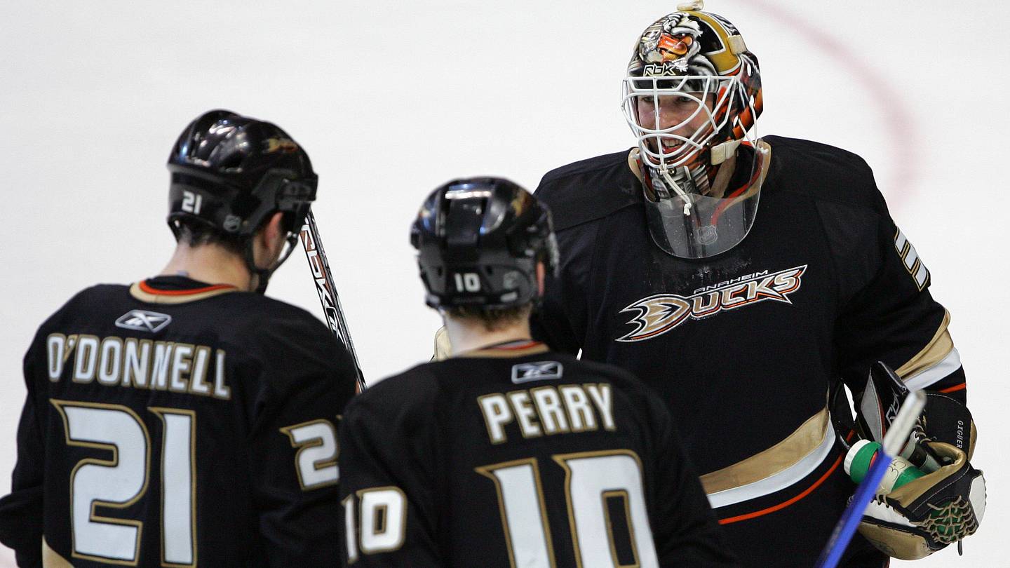 January 9, 2008; Anaheim CA, USA; Anaheim Ducks goalie Jean-Sebastien Giguere (35), defenseman Sean O'Donnell (21), and right wing Corey Perry (10) celebrate after the Ducks win 5-0 against the Toronto Maple Leafs at the Honda Center in Anaheim CA. Mandatory Credit: Gary A. Vasquez-USA TODAY Sports