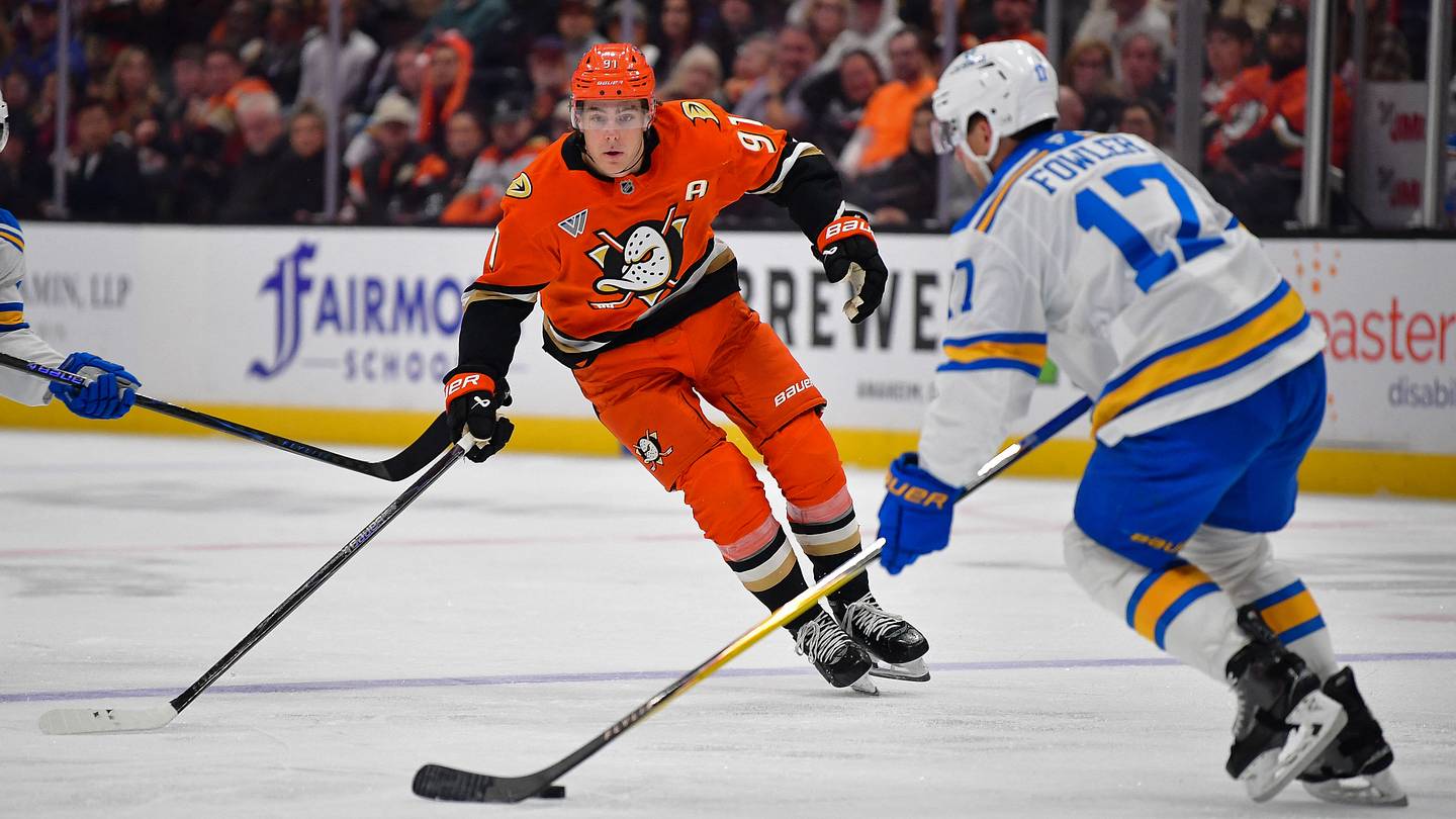 Apr 3, 2026; Anaheim, California, USA; Anaheim Ducks center Leo Carlsson (91) moves in for the puck against St. Louis Blues defenseman Cam Fowler (17) during the second period at Honda Center. Mandatory Credit: Gary A. Vasquez-Imagn Images