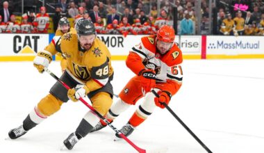 May 12, 2026; Las Vegas, Nevada, USA; Anaheim Ducks left wing Cutter Gauthier (61) sweeps the puck away from Vegas Golden Knights center Tomas Hertl (48) during the first period of game five of the second round of the 2026 Stanley Cup Playoffs at T-Mobile Arena. Mandatory Credit: Stephen R. Sylvanie-Imagn Images