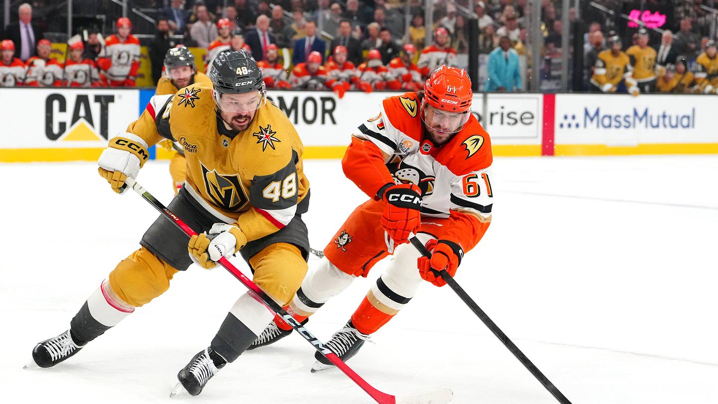 May 12, 2026; Las Vegas, Nevada, USA; Anaheim Ducks left wing Cutter Gauthier (61) sweeps the puck away from Vegas Golden Knights center Tomas Hertl (48) during the first period of game five of the second round of the 2026 Stanley Cup Playoffs at T-Mobile Arena. Mandatory Credit: Stephen R. Sylvanie-Imagn Images