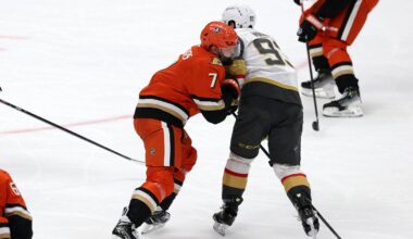 Feb 1, 2026; Anaheim, California, USA;  Anaheim Ducks defenseman Radko Gudas (7) checks Vegas Golden Knights right wing Mitch Marner (93) during the third period at Honda Center. Mandatory Credit: Kiyoshi Mio-Imagn Images