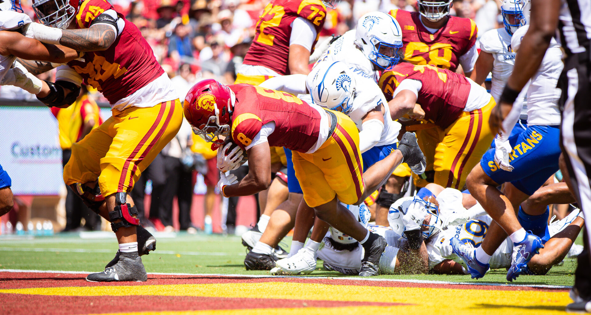 King Miller pushes into the end zone