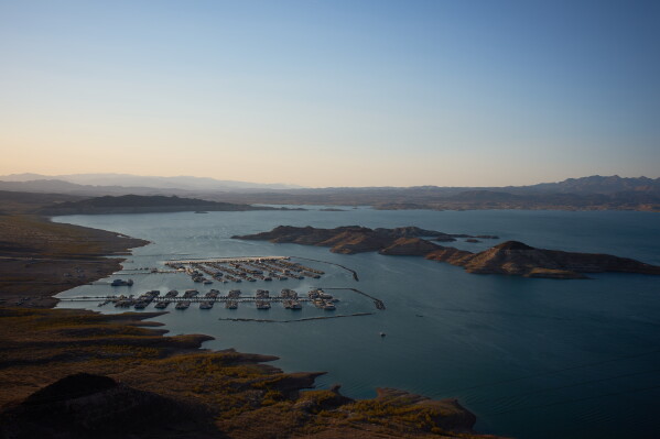 Boats are moored at a marina on Lake Mead at the Lake Mead National Recreation Area on Tuesday, June 30, 2026, near Boulder City, Nev. (AP Photo/John Locher)