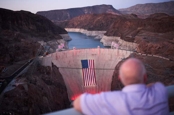 FILE - A bathtub ring of light minerals shows the high water line of Lake Mead near Hoover Dam at the Lake Mead National Recreation Area, June 30, 2026, near Boulder City, Nev. (AP Photo/John Locher, File)