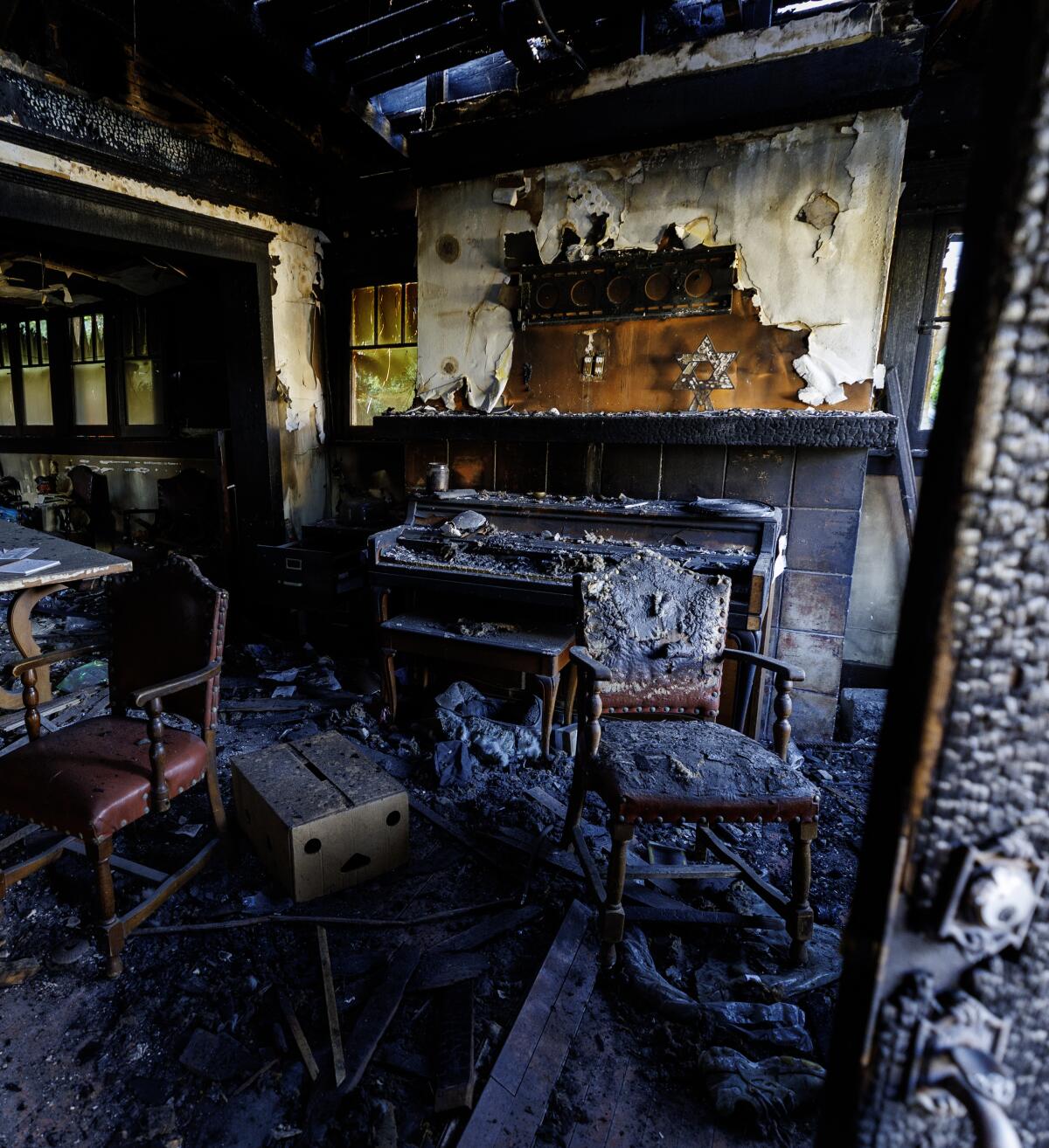 Pastor Juan Galicia and his family lost two dogs and many antiques in a fire which started in a vacant lot next door.