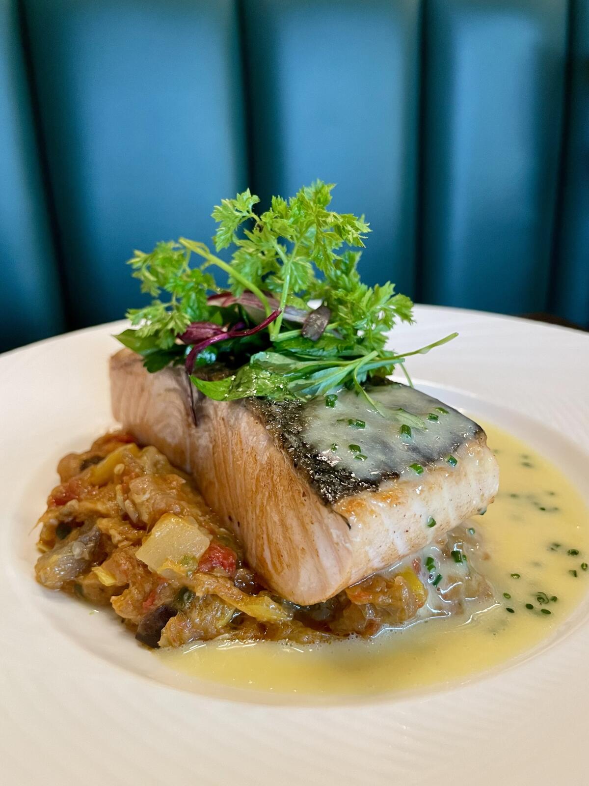 Saffron beurre blanc accompanies "slightly undercooked" roasted Norwegian salmon at Gordon Ramsay at The Carnaby.